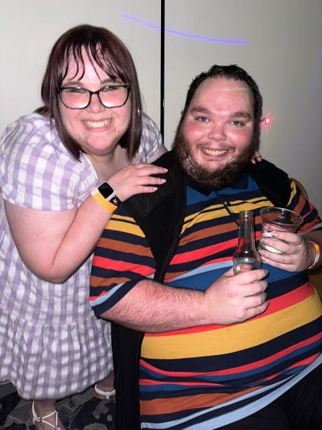 A man and a woman smiling