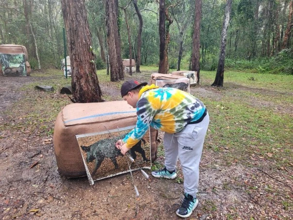 A man pulling out arrows