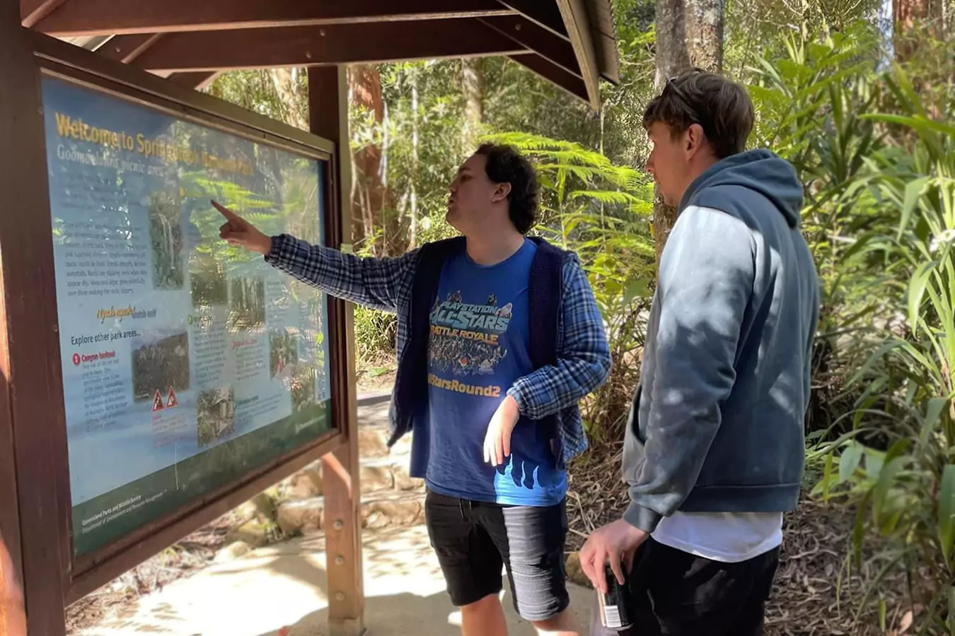 Two men looking at a board