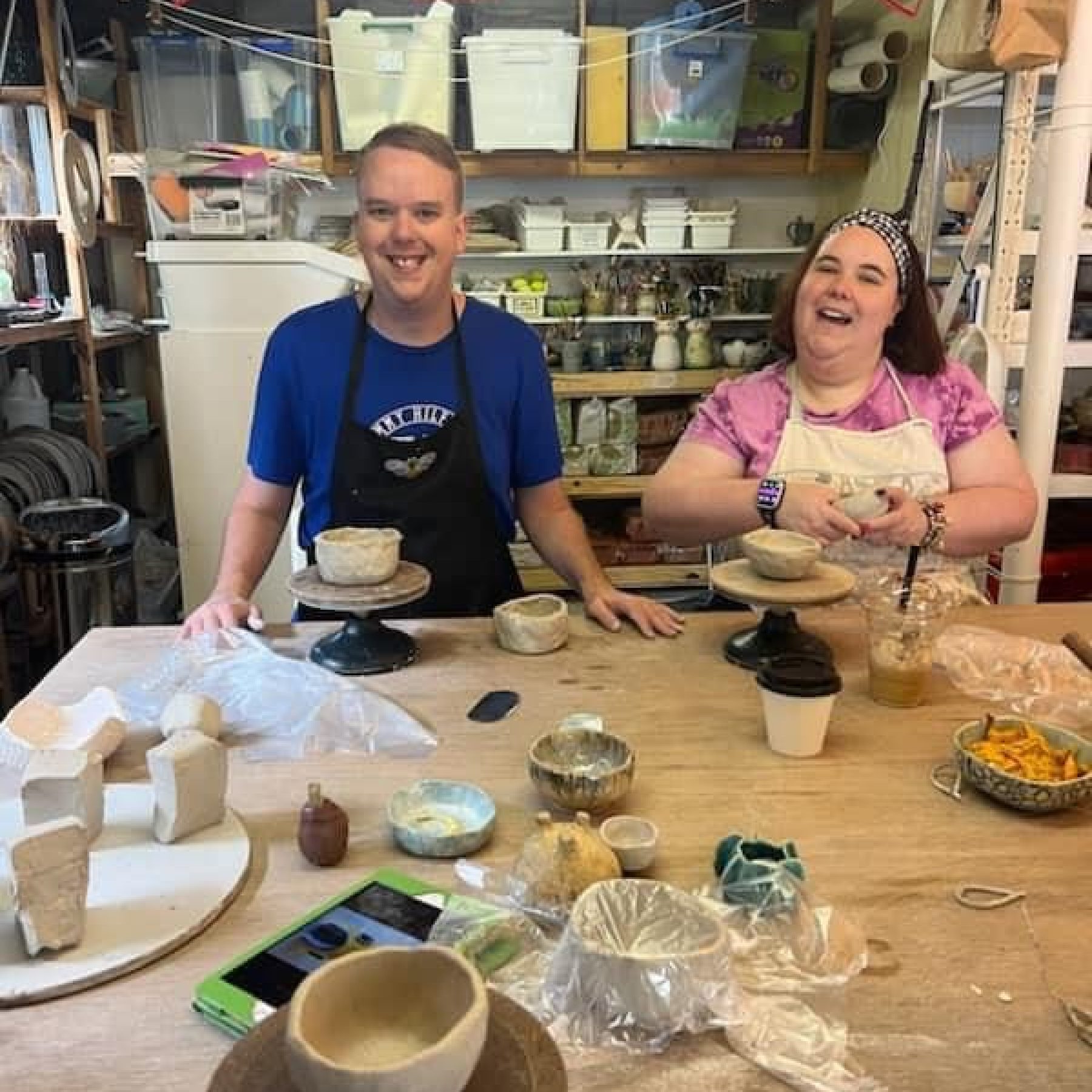 Two people doing art crafts