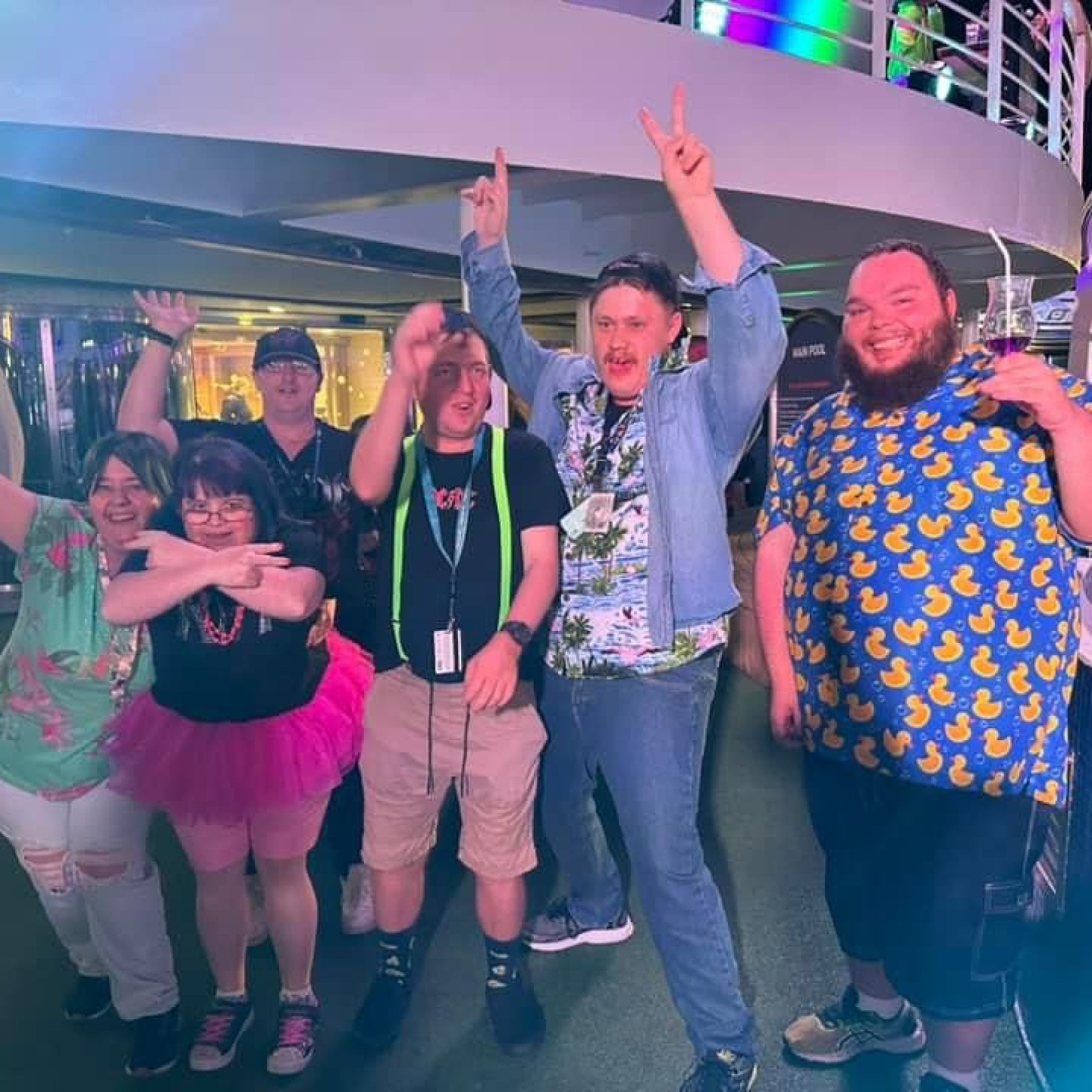 Group of people smiling while doing different poses