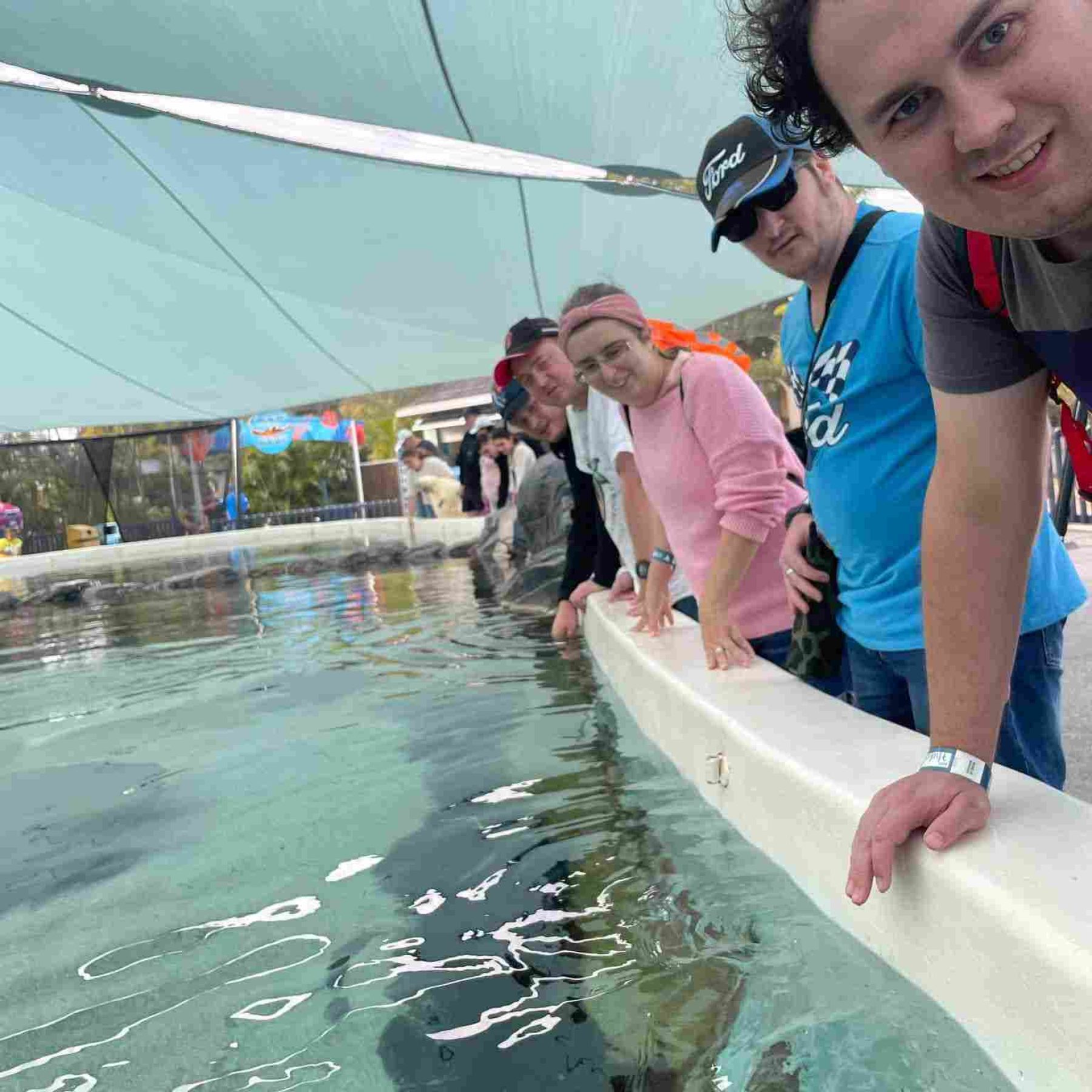 Group of people in front of an aquarium