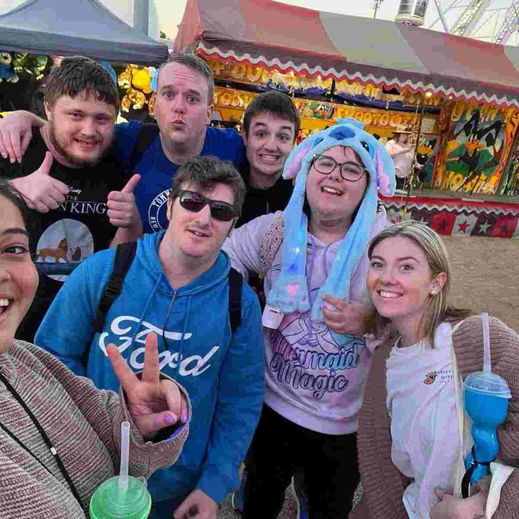 Group of people smiling for a selfie