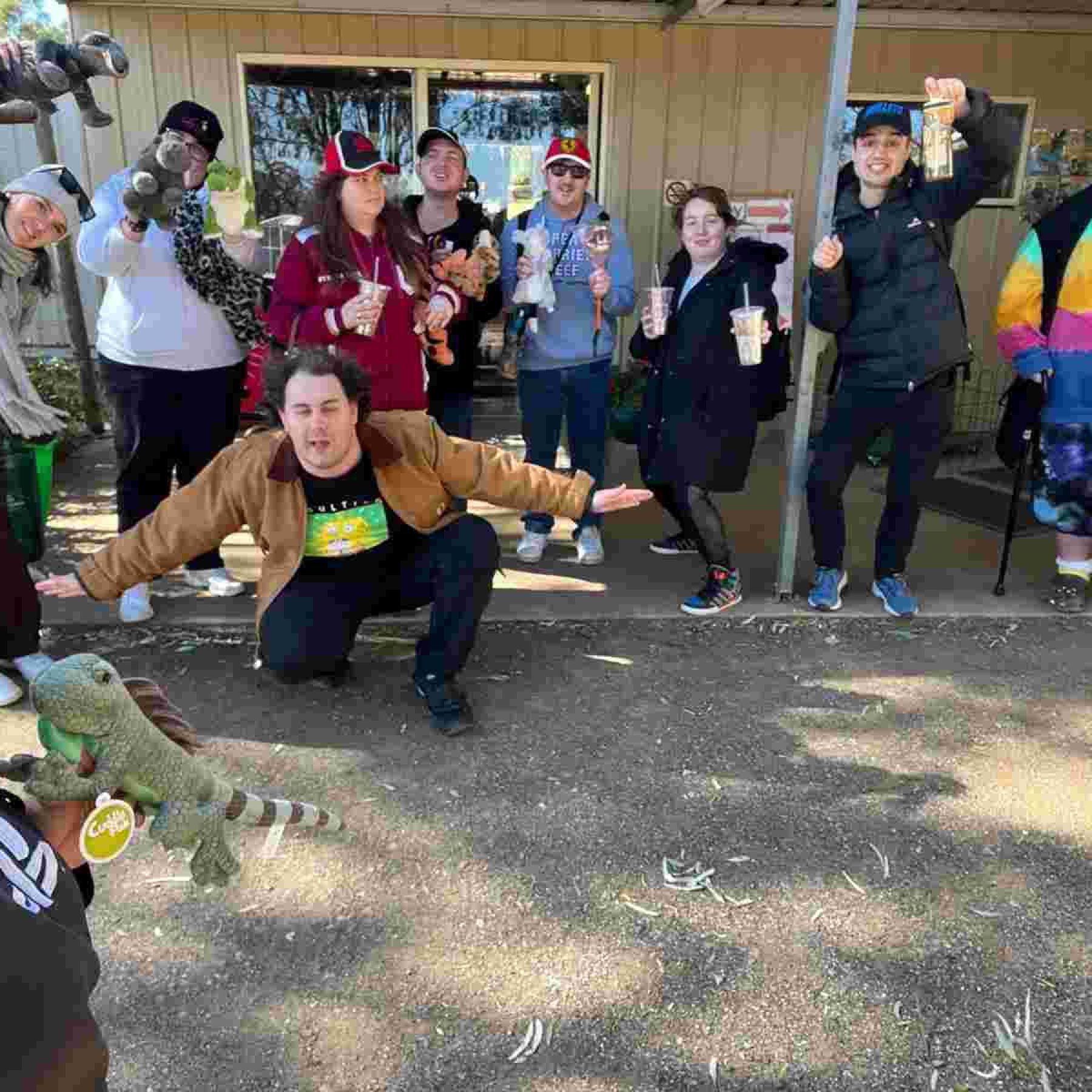 Group of people smiling while doing different poses