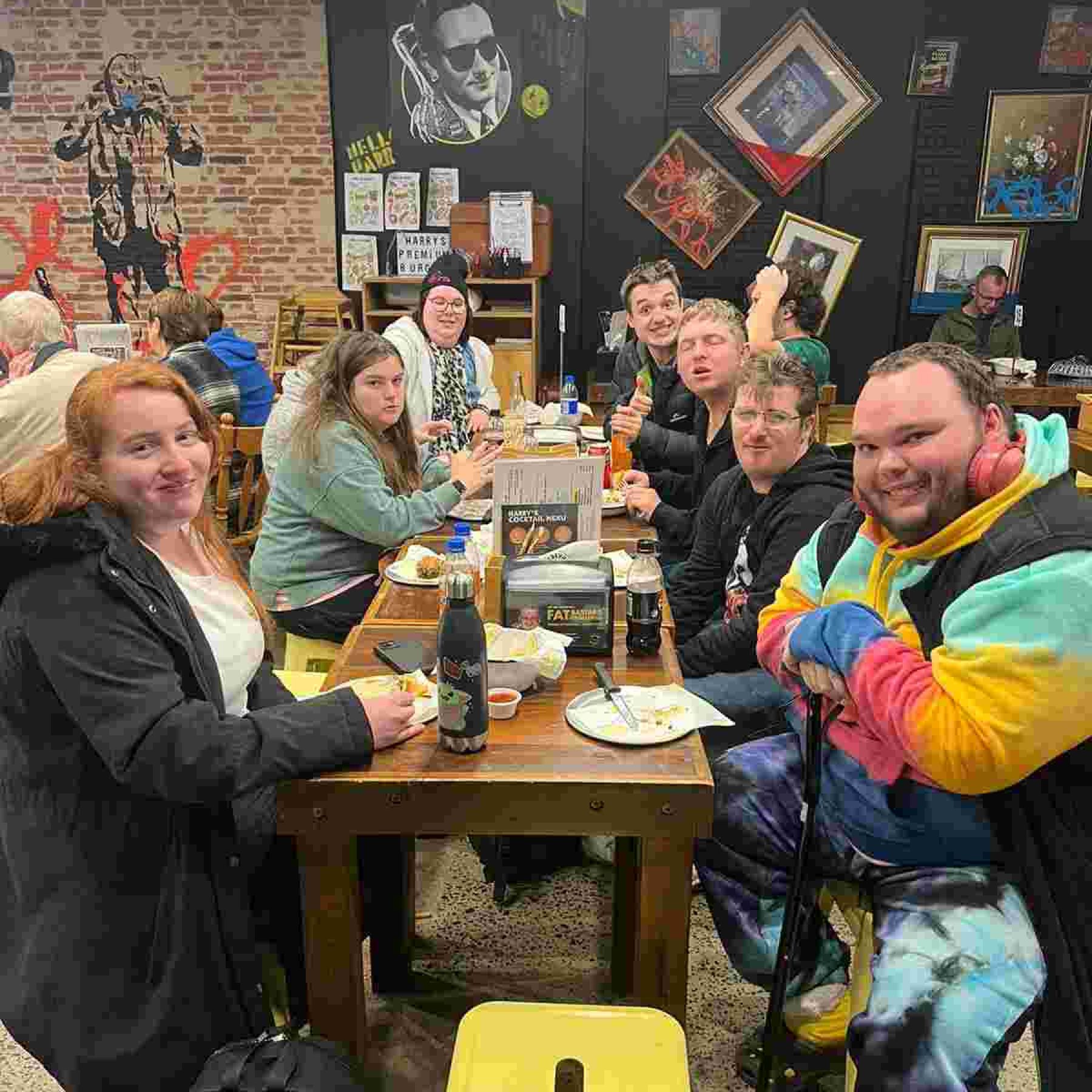 Group of people smiling inside the restaurant